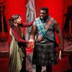 A Black male Actor and a white femal actor portal Mabeth and Lady Macbeth, with blood on their hands